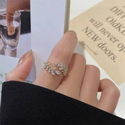 خاتم مطلي بالذهب – على شكل شجرة – مزين بحبوب الزركون اللامعة | ستانلس ستيل 316