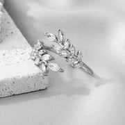 خاتم مطلي بالذهب – على شكل شجرة – مزين بحبوب الزركون اللامعة | ستانلس ستيل 316